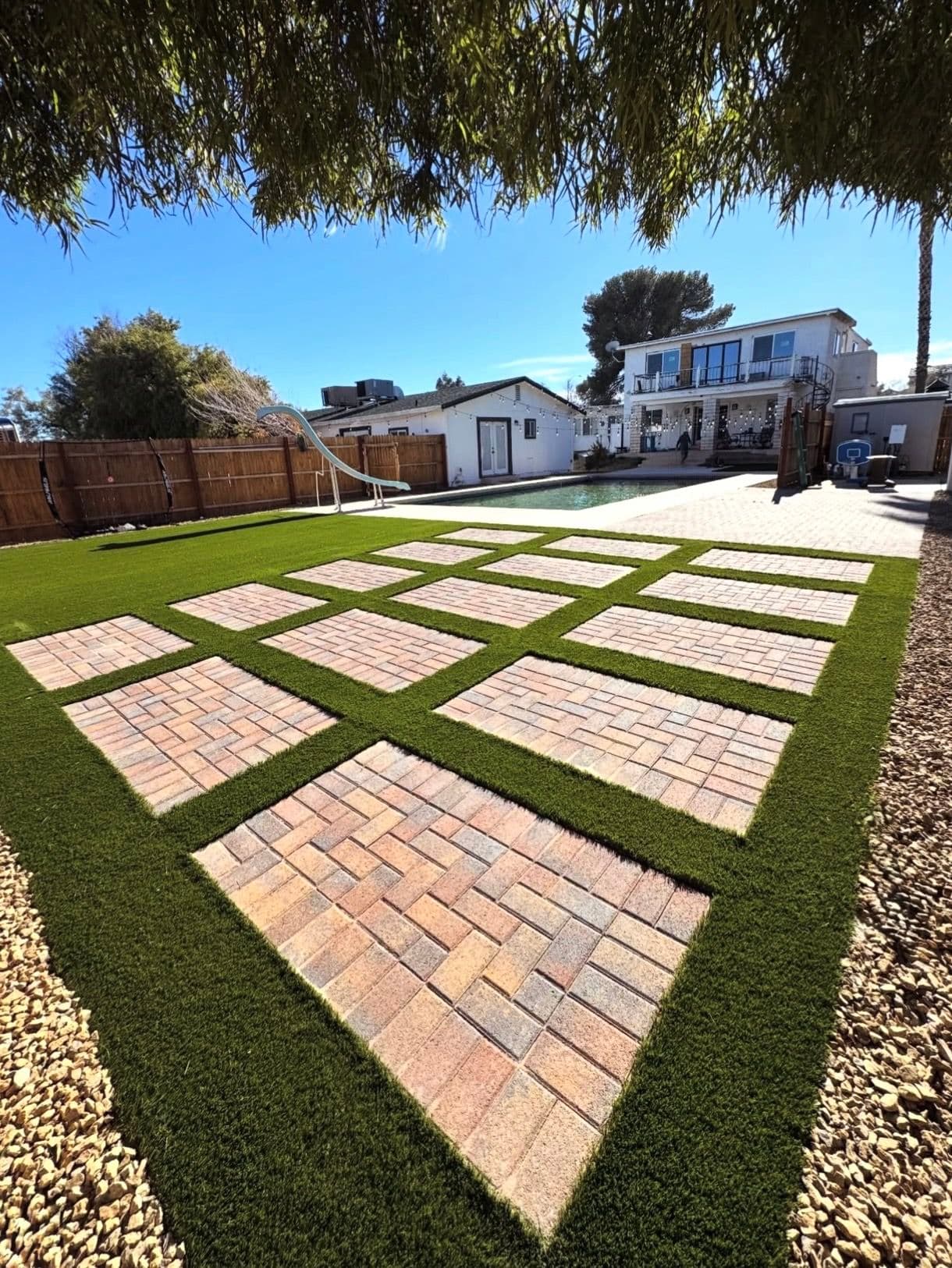 Backyard Bliss Achieved with Easy-Care Turf and Custom Pavers